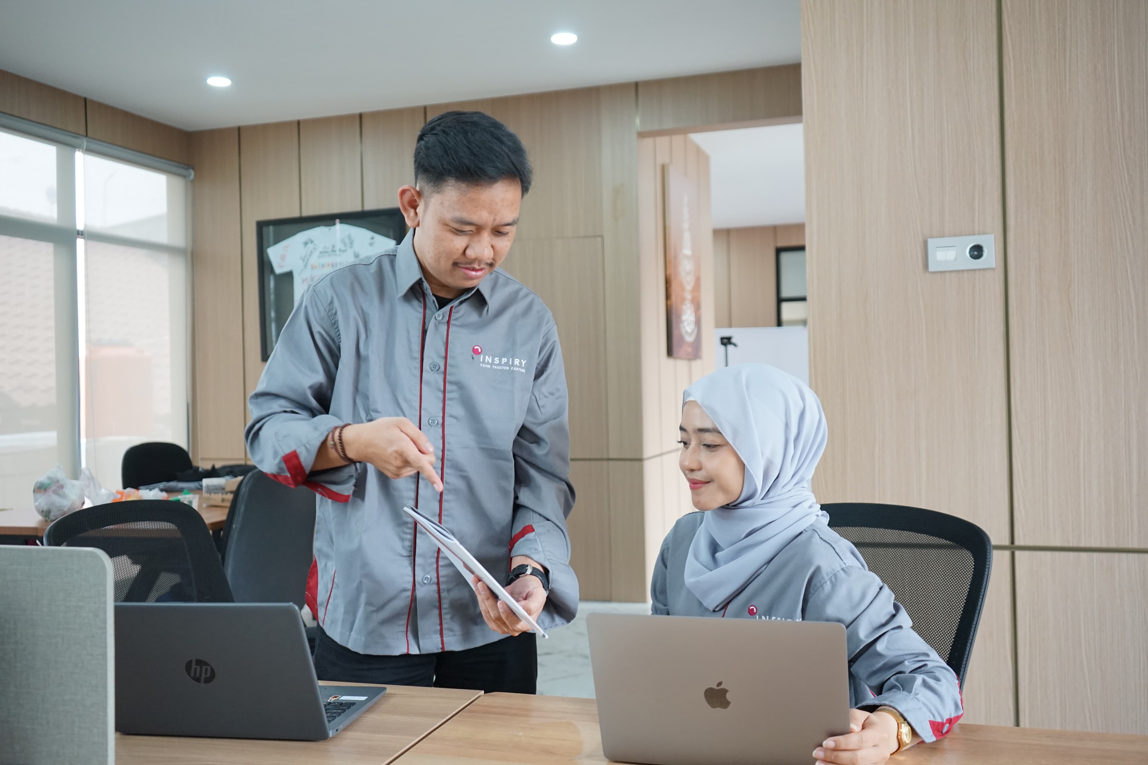 a guy showing inspiry brochure